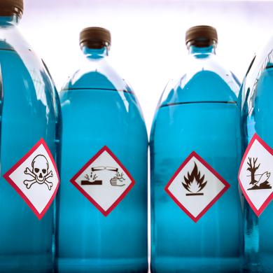 Chemical Hazard Labels on Blue Bottles