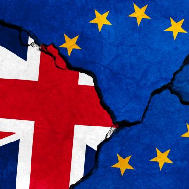 GB & EU flags on cracked concrete.