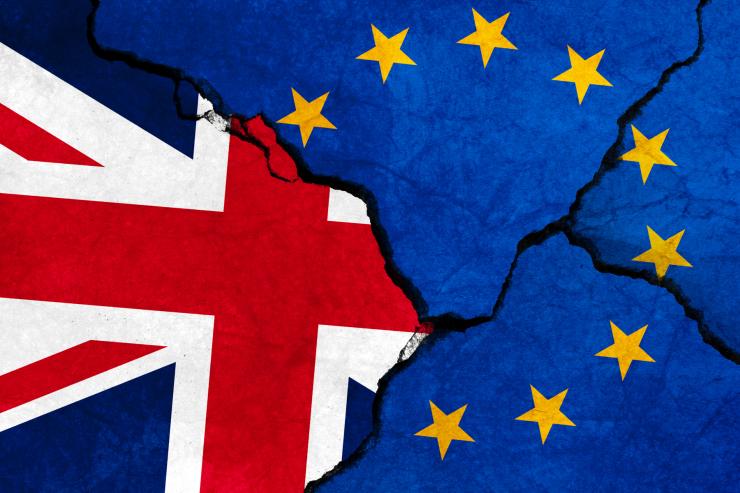 GB & EU flags on cracked concrete.