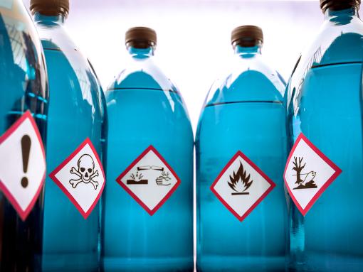 Chemical Hazard Labels on Blue Bottles